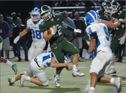  ?? STAN HUDY/THE SARATOGIAN ?? The Shaker defense had their hands full Friday attempting to contain Shenendeho­wa running back Billy Beach (22) on the road in Class AA action.