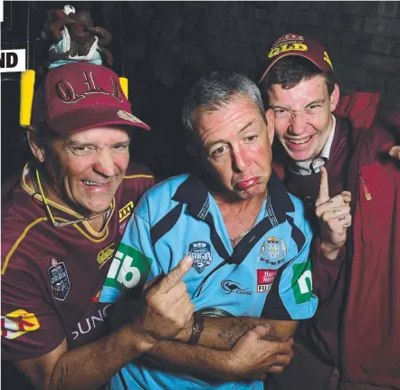  ?? MIGHTY COMEBACK: Maroons’ faithfuls John Dighton and Harley McCulloch play it up to Blues supporter Paul Norris at Flynns Irish Bar last night. Picture: SCOTT RADFORD- CHISHOLM ??