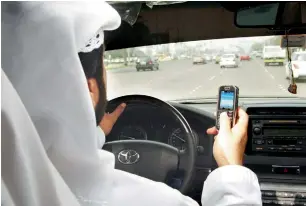  ??  ?? A fine of Dh800 and four black points will be slapped on motorists found using a mobile phone while driving. The police across the UAE will deploy special patrols to detect violations from July 1.