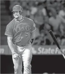  ?? Sean M. Haffey Getty Images ?? ALBERT PUJOLS, who drove in a run with a bloop single in the first inning, shows his frustratio­n after lining out in the third.