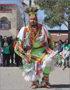  ?? ?? Pow wow dancer Delvin Stanley from Nekaneet First Nation performs the grass dance during the ReconciliA­CTION outdoor program on Market Square, May 11.