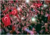  ?? PHOTO: GETTY IMAGES ?? People watch on while a speech by Turkey’s President Recep Tayyip Erdogan is shown on a big screen in Taksim Square.