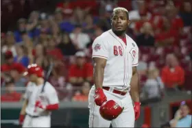  ?? JOHN MINCHILLO — THE ASSOCIATED PRESS ?? The Reds’ Yasiel Puig reacts to a called strike by umpire Larry Vanover during the ninth inning against the Pirates on July 30 in Cincinnati.