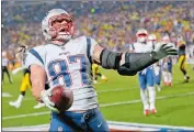  ?? KEITH SRAKOCIC/AP PHOTO ?? In this Dec. 17, 2017 file photo New England Patriots tight end Rob Gronkowski celebrates a touchdown catch in a game against the Pittsburgh Steelers.