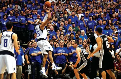  ??  ?? Without letting his right foot come down on the line, Dallas Mavericks guard Vince Carter puts up the game-winning basket during Game 3 in the first round of the NBA basketball playoffs against the San Antonio Spurs in Dallas. The Mavericks won 109-108.