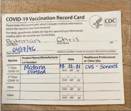  ?? Courtesy photos / Chris Bateman ?? You can’t put out too many reminders on the morning of your vaccine (above left). Chris Bateman is now a card-carrying shot receptor, and this is proof (above right).