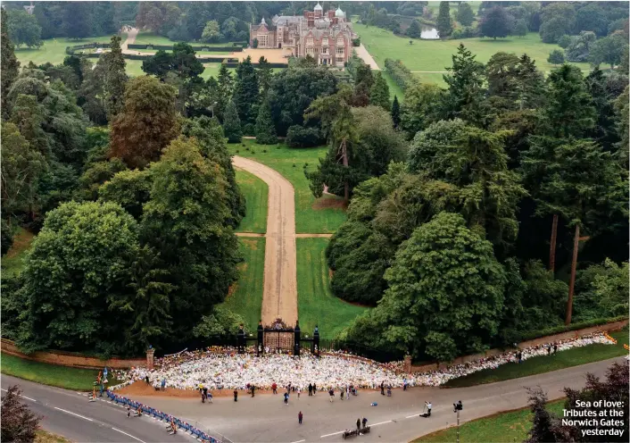  ?? ?? Sea of love: Tributes at the Norwich Gates yesterday