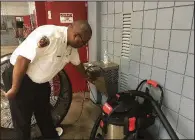  ?? Arkansas Democrat-Gazette/DALE ELLIS ?? Pine Bluff Fire Chief Shauwn Howell shows how high the water rose into the main fire station during Monday evening’s deluge.