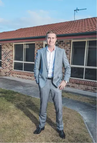  ?? Picture: JERAD WILLIAMS ?? Real estate agent Michael Folkard outside the home at 46 Crusader Way, Nerang, which is open to offers over $399,000.