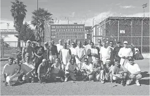  ?? PHOTO COURTESY OF FRANK RUONA ?? The San Quentin State Prison’s 1,000-mile run club poses for a group photo. More than 30 inmates run on the team, and 20 are expected to finish a Nov. 16 behind-bars marathon.