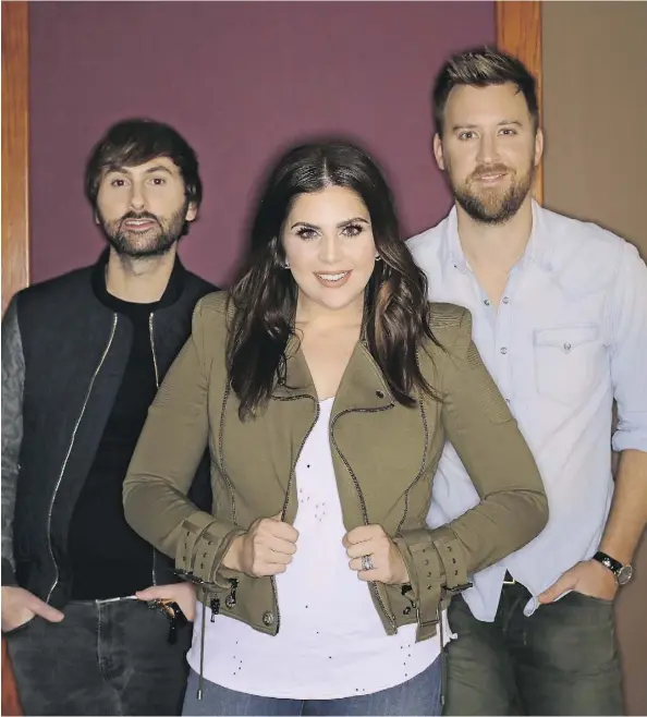  ?? MARK HUMPHREY/THE ASSOCIATED PRESS ?? The members of Lady Antebellum include Dave Haywood, left, Hillary Scott, and Charles Kelley.