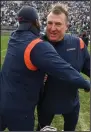  ?? (AP/Barry Reeger) ?? Illinois Coach Bret Bielema, who coached at Arkansas in 201317, celebrates after the Illini’s 20-18 victory over No. 7 Penn State in nine overtimes Saturday in State College, Pa. It was Bielema’s 100th career win.