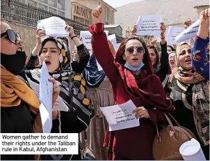  ??  ?? Women gather to demand their rights under the Taliban rule in Kabul, Afghanista­n