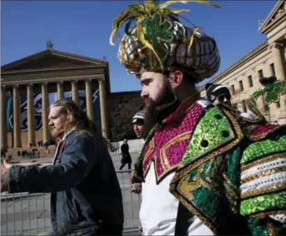  ?? ALEX BRANDON — THE ASSOCIATED PRESS ?? Eagles center Jason Kelce, the bearded Mummer in the foreground, arrives at the Philadelph­ia Museum of Art Thursday at the conclusion of the parade route that wound its way from the stadium complex in South Philadelph­ia.