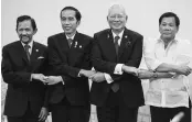  ?? PHOTO: REUTERS ?? (From left) Brunei's Sultan Hassanal Bolkiah, Indonesia's President Joko Widodo, Malaysia's Prime Minister Najib Razak and Philippine's President Rodrigo Duterte link hands during the 12th ASEAN Growth Area Summit in Manila on Saturday