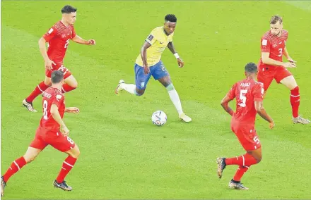  ?? Picture: REUTERS ?? Brazil’s Vinicius Junior in action with Switzerlan­d’s Fabian Rieder, Silvan Widmer, Remo Freuler and Manuel
Akanji during their Group G match at the FIFA World Cup Qatar 2022.