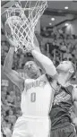  ?? Sue Ogrocki / AP ?? The Spurs’ Tim Duncan, right, blocks a shot by the Thunder’s Russell Westbrook.