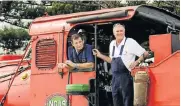  ?? Picture: WERNER HILLS ?? RIDING IN RED: Nelson Mandela Bay Steam Train ‘fireman’ Gary Ruddy, left, and train driver Hennie van Rooyen took passengers via rail from the Kings Beach parking lot to the Port Elizabeth Internatio­nal Airport this summer