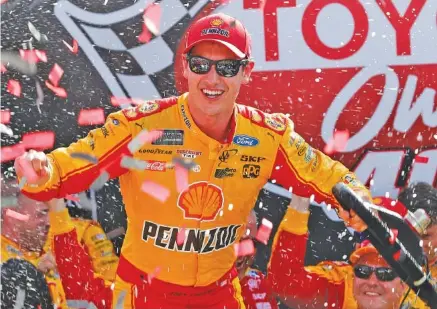  ?? THE ASSOCIATED PRESS ?? Joey Logano capitalize­d on two restarts to win Sunday’s NASCAR Cup Series race at Richmond Internatio­nal Raceway. It’s his 18th career win.