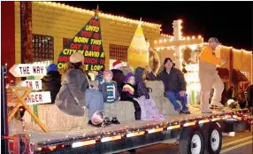  ??  ?? The float of First Baptist Church of Decatur makes its way down Main St. in Decatur on Dec. 9 as part of the Decatur Chamber of Commerce’s annual Christmas Parade. This float was awarded first place in the nonprofit division by a panel of judges made...