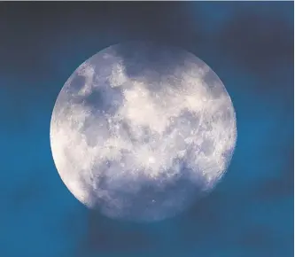  ??  ?? Some broken low clouds passing in front of the moon late afternoon over Dubbo made a stunning photo, shot with a long range lens.