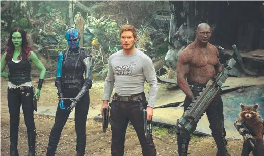  ??  ?? Left, Karen Gillan. Centre, Chris Pratt, followed by Dave Bautista and Rocket, voiced by Bradley Cooper