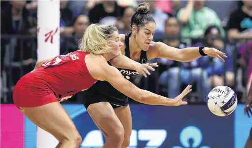  ?? PHOTO: GETTY IMAGES ?? It’s mine . . . England’s Francesca Williams (left) and Maia Wilson, of the Silver Ferns, scrap for possession during the opening test of the Taini Jamison Trophy Series at Claudeland­s Arena in Hamilton last night.