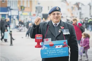  ?? YRN-151026-164115016 ?? Bob Smith, ex-Royal Navy chief petty officer, sells poppies in Westboroug­h.