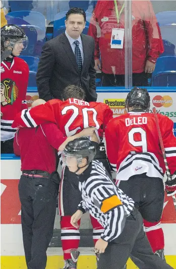  ?? THE CANADIAN PRESS/FILES ?? As coach of the Portland Winterhawk­s, Travis Green led the WHL team to a 37-8-2 record and the championsh­ip in 2013. The Canucks are expected to name Green as their new head coach today.