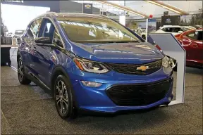  ?? GENE J. PUSKAR — THE ASSOCIATED PRESS ?? A 2020Chevro­let Bolt EV on display at the 2020Pittsb­urgh Internatio­nal Auto Show in Pittsburgh. General Motors is recalling all Chevrolet Bolt electric vehicles sold worldwide to fix a battery problem that could cause fires.
