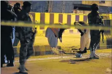  ?? Picture: AFP ?? DEADLY SCENE: Pakistani security personnel inspect the site of an explosion in Quetta. On Monday two members of a bomb disposal squad were killed in Quetta city