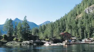  ?? PHOTOS: JANE STEVENSON ?? A boat tour with Egmont Adventure Centre immerses passengers in the area’s rugged coastal scenery. Highlights include a stop for lunch at Chatterbox Falls.