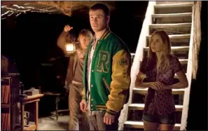  ?? Democrat-gazette file photo ?? Fran Kranz (left), Chris Hemsworth and Anna Hutchison appear in a scene from The Cabin in the Woods. Kranz provides the horror movie’s comic relief.