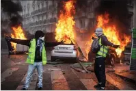  ??  ?? Rage explodes on the streets of Paris.