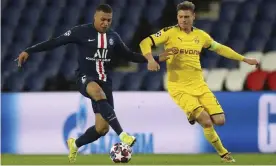  ?? Photograph: AP ?? Kylian Mbappé (left) and PSG might have to play the remainder of their Champions League campaign outside of France.