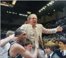  ?? FILE — THE ASSOCIATED PRESS ?? In this file photo, Villanova coach Rollie Massimino takes a victory ride on his players shoulders following the 1985 NCAA Championsh­ip. Massimino, who led Villanova’s storied run that season and won more than 800 games in his career, died Wednesday...