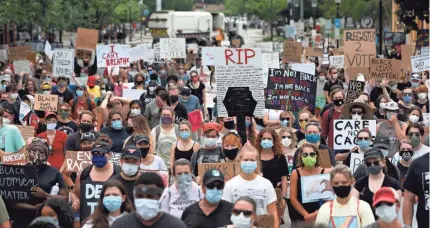  ?? JOSHUA L. JONES/USA TODAY NETWORK ?? People gather in downtown Athens, Ga., on Saturday for a “Justice For Black Lives Rally” following the deaths of George Floyd, Breonna Taylor and Ahmaud Arbery. Similar rallies have swept across America.