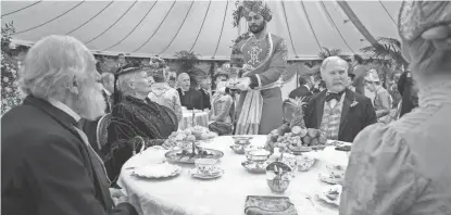  ?? FOCUS FEATURES ?? Lord Salisbury (Michael Gambon, from left), Queen Victoria (Judi Dench), Abdul Karim (Ali Fazal) and Henry Ponsonby (Tim Pigott-Smith) attend a reception in "Victoria and Abdul."