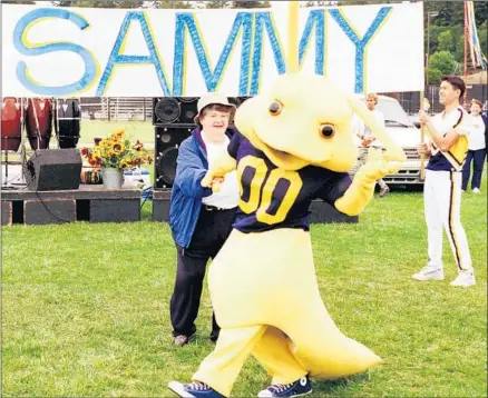  ?? Dan Coyro Associated Press ?? UC SANTA CRUZ Chancellor M.R.C. Greenwood dances with Sammy the Slug, the university’s new mascot, as it is introduced in 1998. The sea lion had been the school’s mascot until students voted overwhelmi­ngly for the unassuming banana slug in 1986.