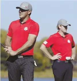  ?? AP PHOTO ?? SWING AND A MISS: Brooks Koepka (left) and Brandt Snedeker won the only point for the U.S. in yesterday afternoon’s session, largely squanderin­g the Americans perfect start in the morning.