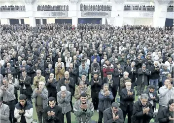  ?? EBRAHIM NOROOZI/AP PHOTO ?? Iranian worshipper­s attend the Friday prayer ceremony in Tehran, Iran. A hard-line Iranian cleric has called on Iran to create its own indigenous social media apps, blaming them for the unrest that followed days of protest in the Islamic Republic over its economy.