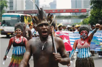  ??  ?? WEST PAPUANS shout slogans during a rally to commemorat­e the 50th anniversar­y of West Papuan independen­ce from Dutch rule, in Jakarta, Indonesia, in December 2011. (Reuters)