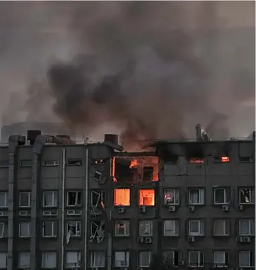  ?? ?? Smoke rises after a Russian drones strike in Kyiv.