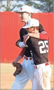  ?? Kelly Shields ?? Pitcher Matthew Shields gets a hug from longtime friend and teammate Josh McAfee as he comes out of the game during LFO’s home finale against Ringgold last week. The Warriors’ season ended with a first-round series loss at Cherokee Bluff this past Thursday.