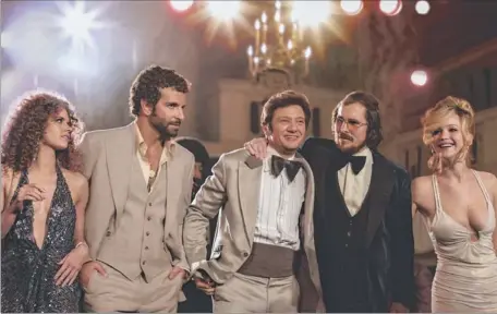  ??  ?? Amy Adams, Bradley Cooper, Jeremy Renner, Christian Bale and Jennifer Lawrence star in American Hustle