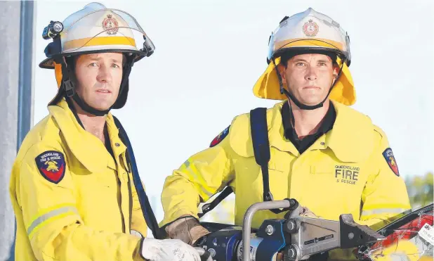  ?? Picture: JUSTIN BRIERTY ?? CHANGING ROLE: Senior firefighte­rs Josh Hyde and Mark Miller at Cairns Fire station.