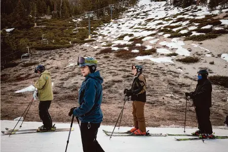  ?? Max Whittaker/Special to the Chronicle 2022 ?? Skiers wait in a lift line at Heavenly Mountain Resort in South Lake Tahoe, where less snow is expected in decades ahead.