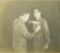  ?? CONTRIBUTE­D PHOTO BY DEBORAH LEVINE ?? Aaron Levine, right, is shown being given a medal for his service during World War II.