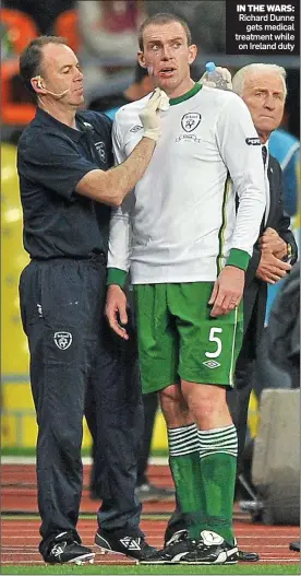  ??  ?? IN THE WARS: Richard Dunne gets medical treatment while on Ireland duty