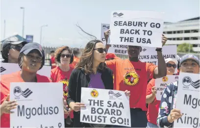  ?? Picture: EPA-EFE ?? HEAR US. Striking South African Airways workers at an entrance to Cape Town Internatio­nal Airport yesterday. SAA flights remain grounded following four days of strikes. Thousands of SAA employees have downed tools in an indefinite protest against mass retrenchme­nts and demanding wage increases.